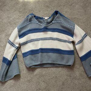 A blue stripped sweater